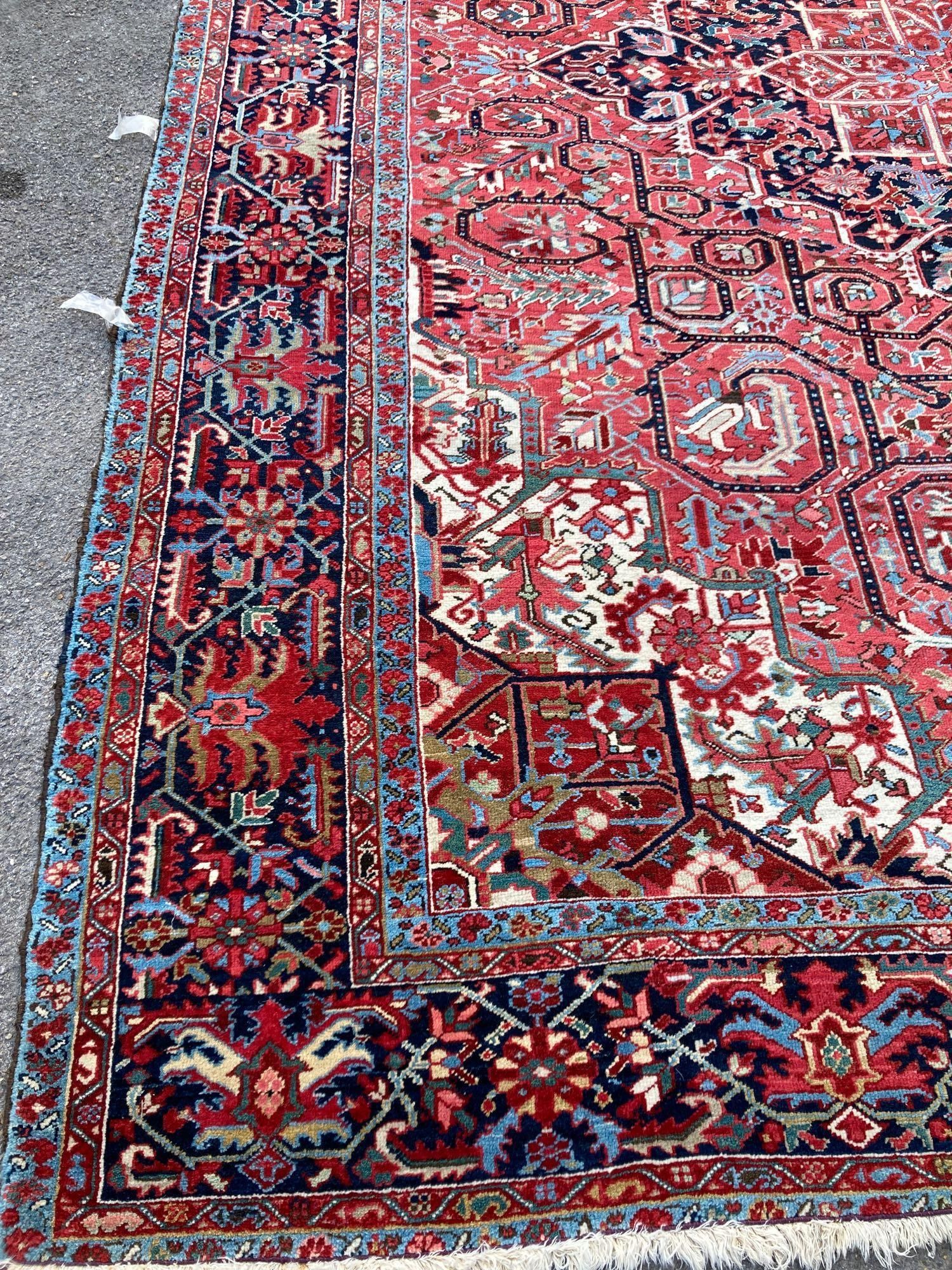 A large Persian red ground carpet, 444 x 347cm